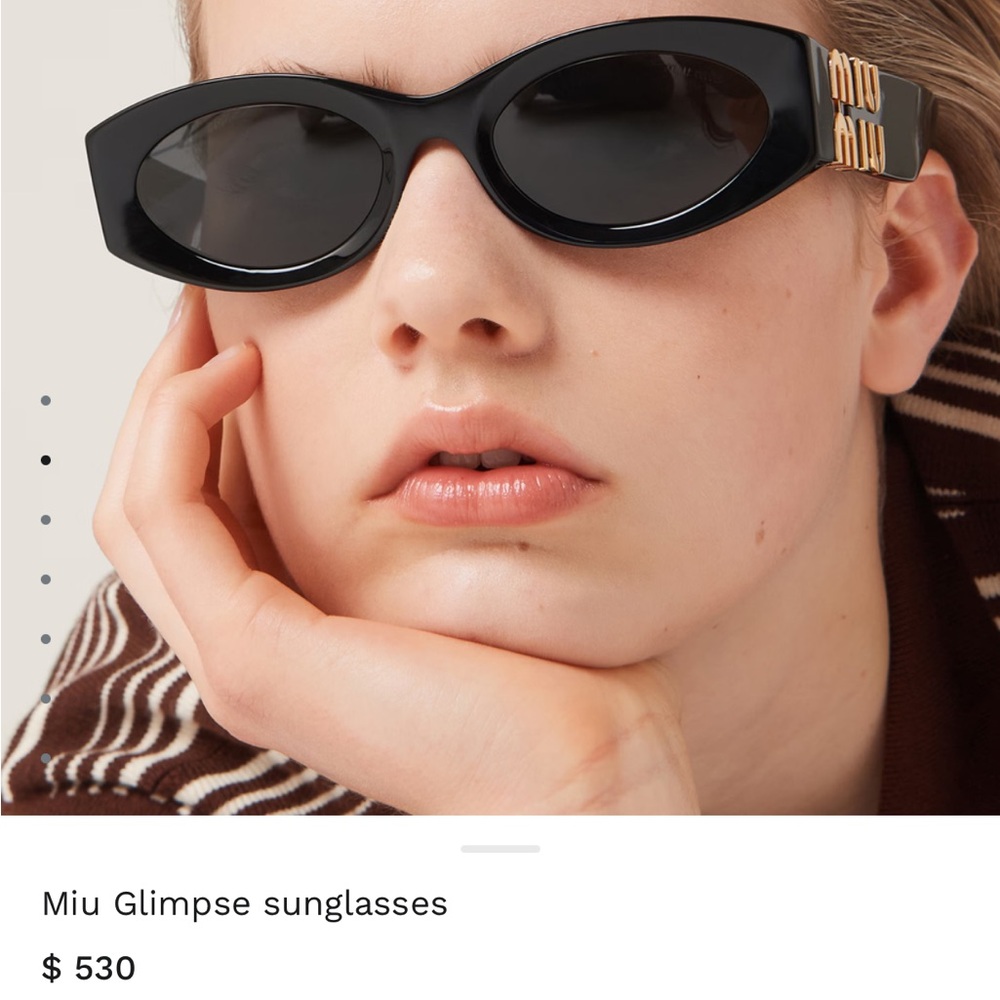 Miu Miu Black Oval Sunglasses with Gold Detail